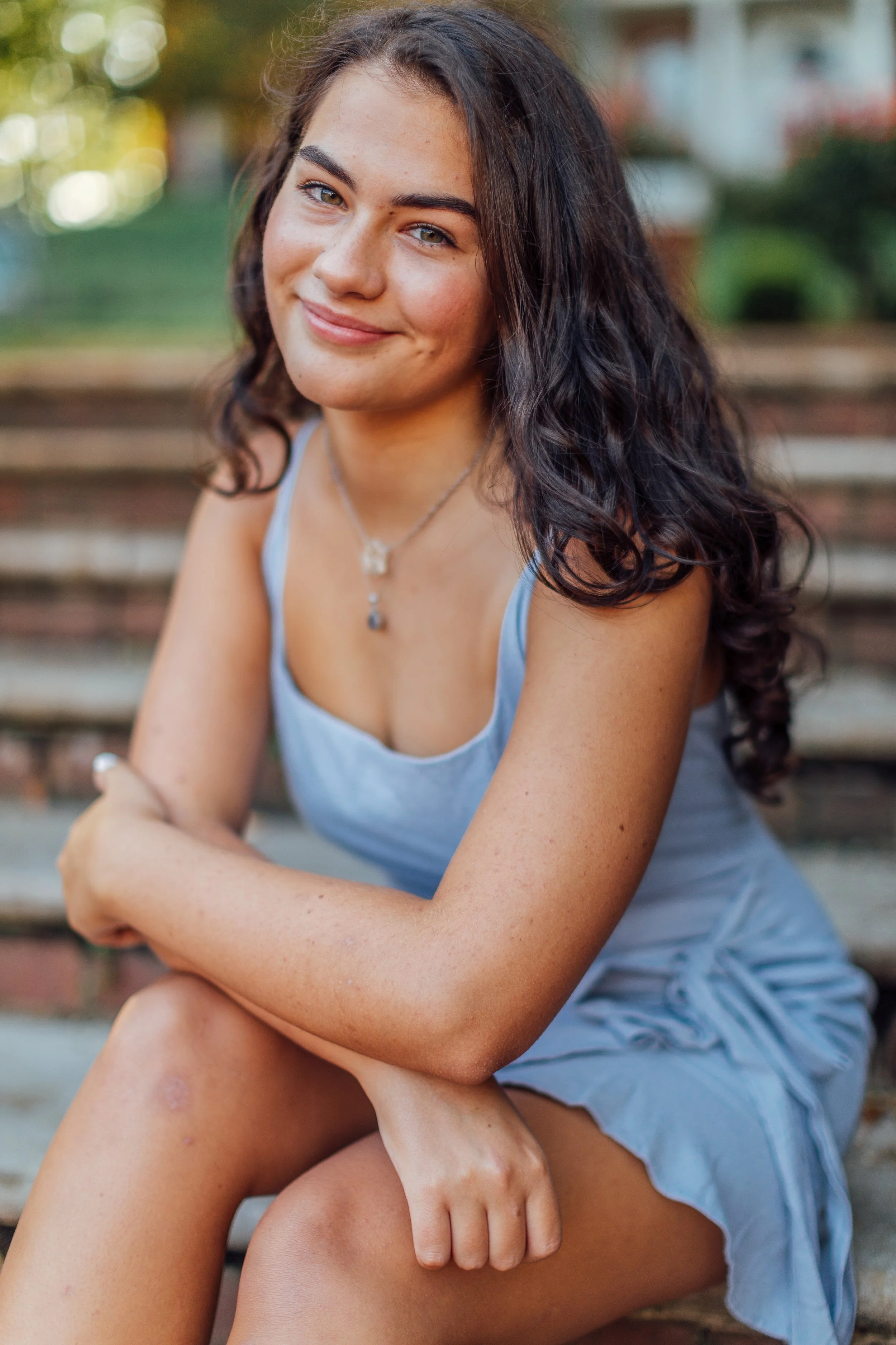 Sitting downtown on the stairs for her Annapolis Senior Portrait session.