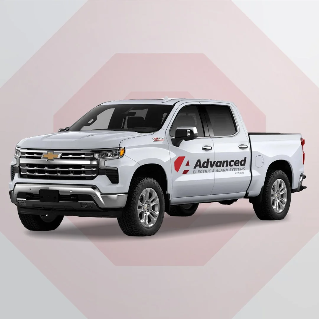 Mockup of a white chevy truck with the logo as a decal on the side.