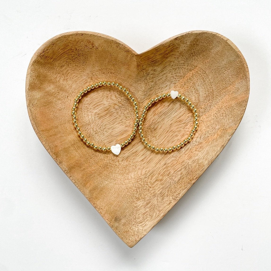 Celebrate Mother&rsquo;s Day in style with our beautiful Big Heart Art Emery bracelets, lovingly crafted by an 11-year-old entrepreneur. Adorned with 18k gold-filled beads and a delicate mother of pearl heart, these bracelets are a heartfelt symbol o