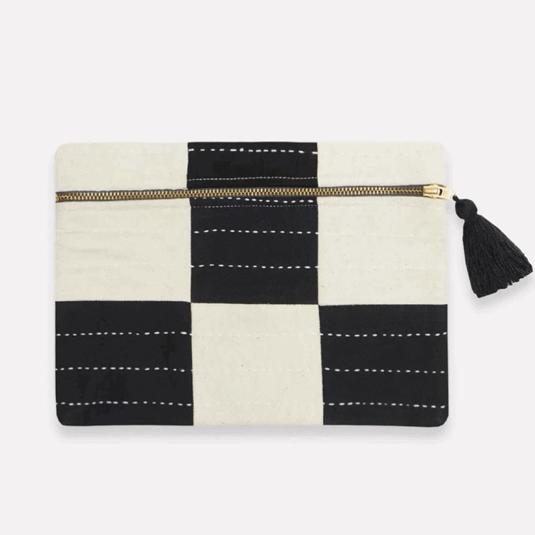Mom is sure to love our heirloom-crafted contemporary clutch featuring a colorblock checkered design with charming stitch details and a tassel zipper pull. She can use it to stay organized, store makeup, a cell phone, or important receipts. Each piec