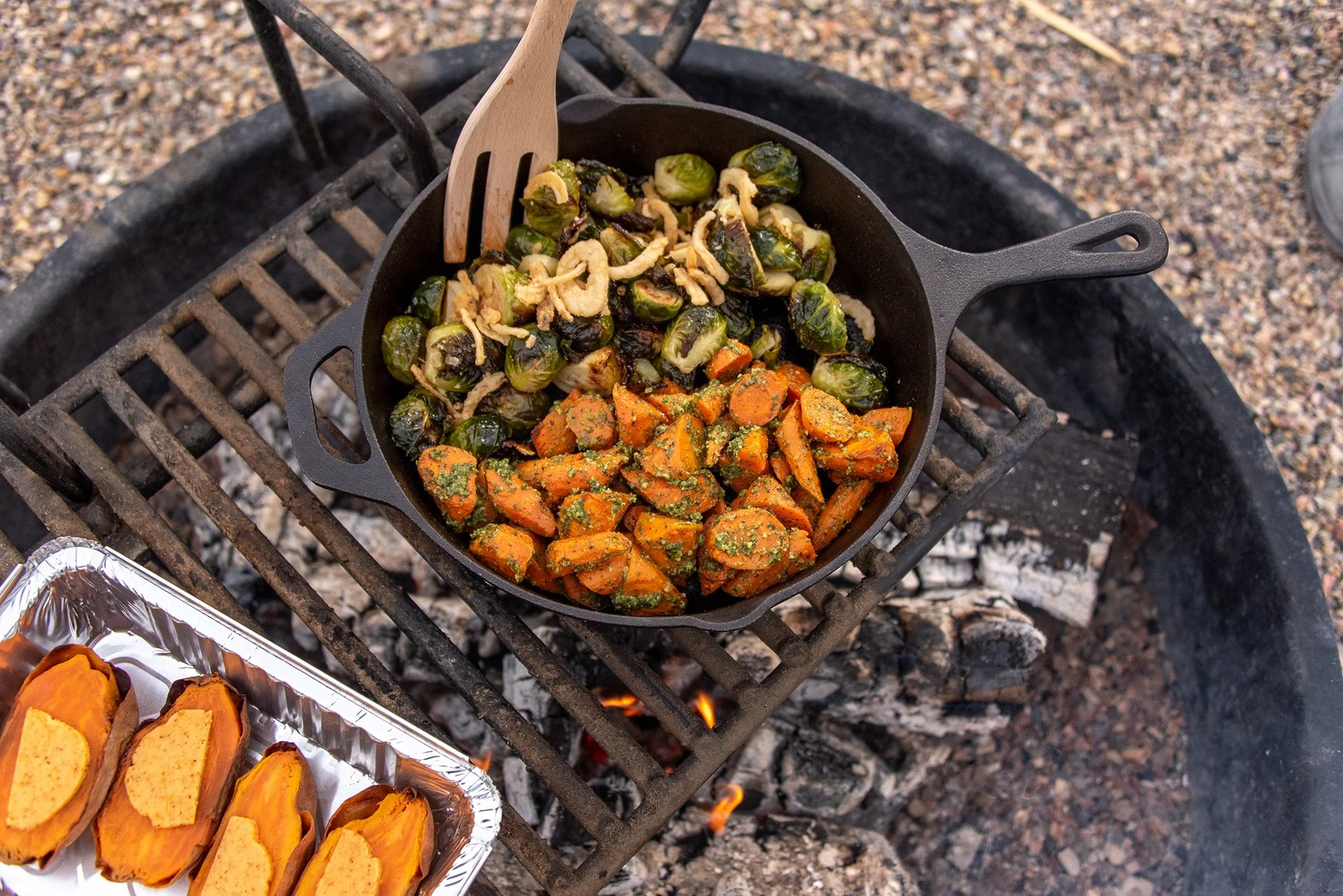 grilled vegetables in a cast iron pan on a wood-fired grill 