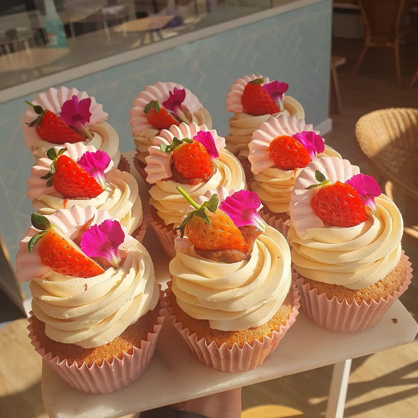 OK, we're calling it, summer is here and we have the cupcakes to prove it, rhubarb and strawberry, and (finally) some pretty petals from the garden