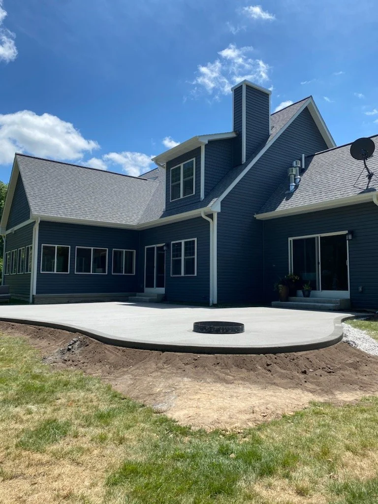 Newly poured concrete patio in backyard