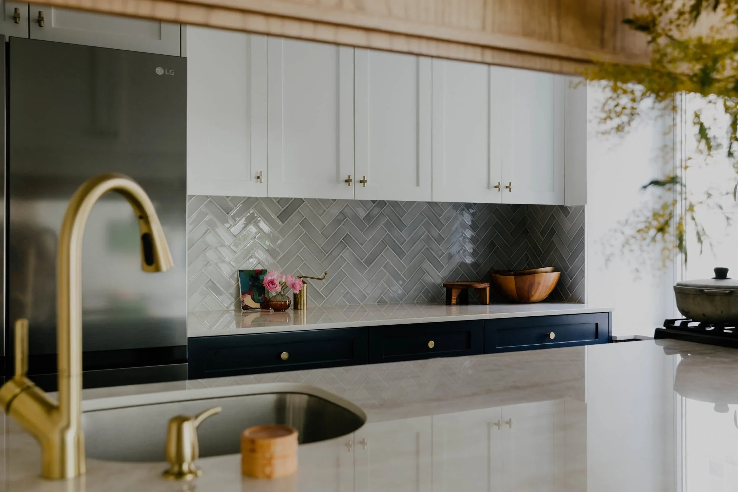 Wellness kitchen design brass fixtures herringbone tile Manhattan.webp