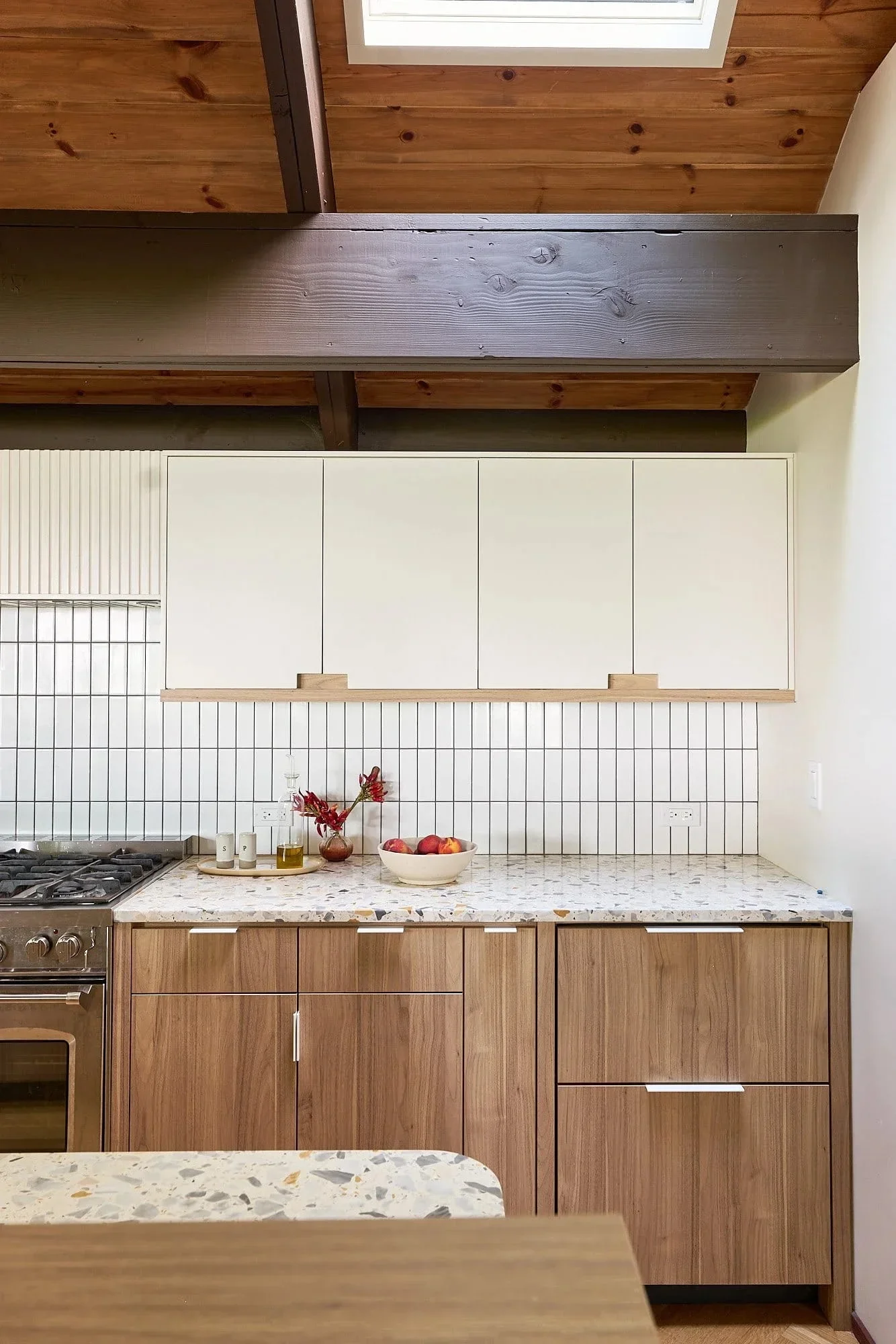 Walnut kitchen terrazzo countertop exposed timber ceiling.webp