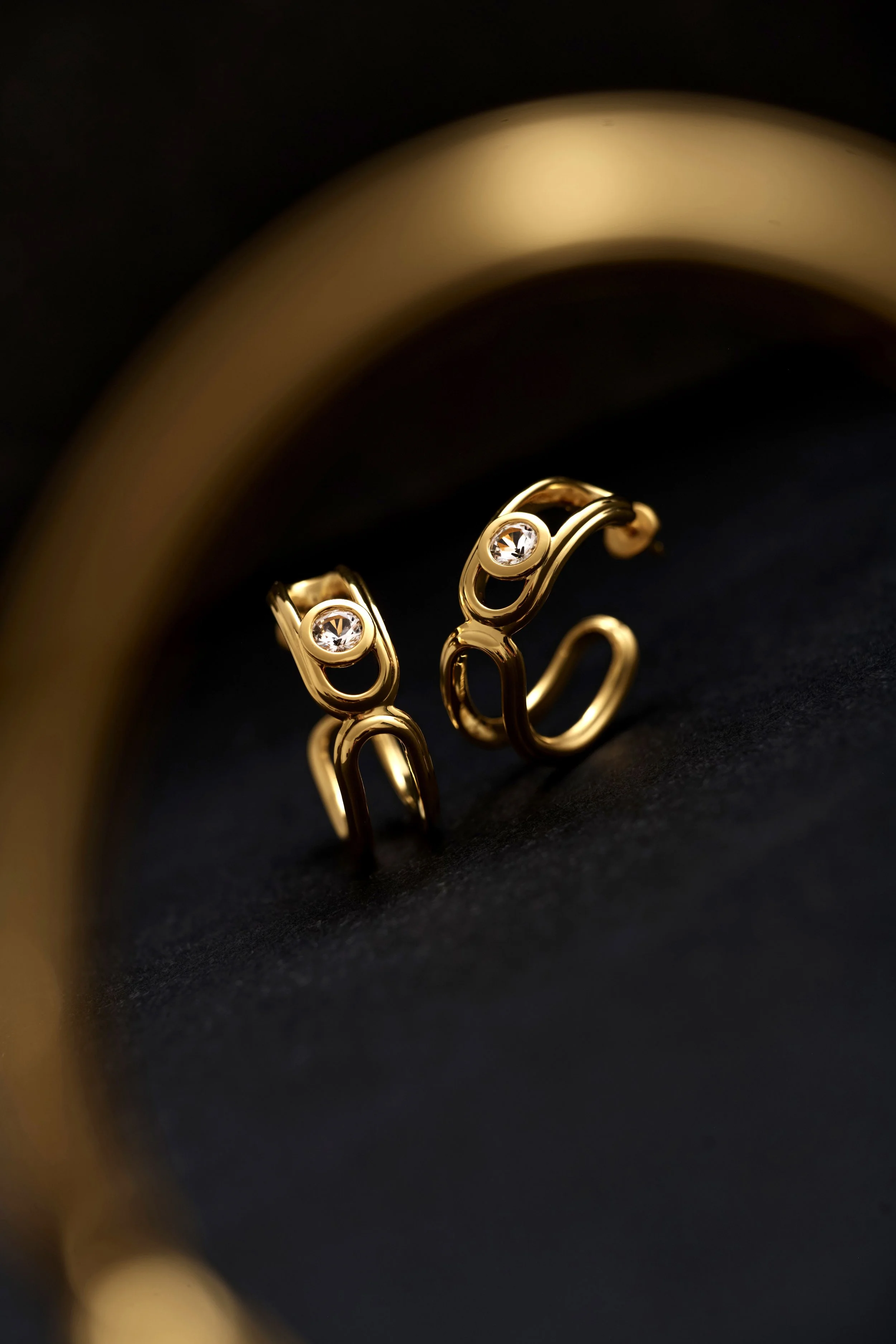 Styled jewellery product photography for e-commerce, featuring gold earrings shot for online campaigns