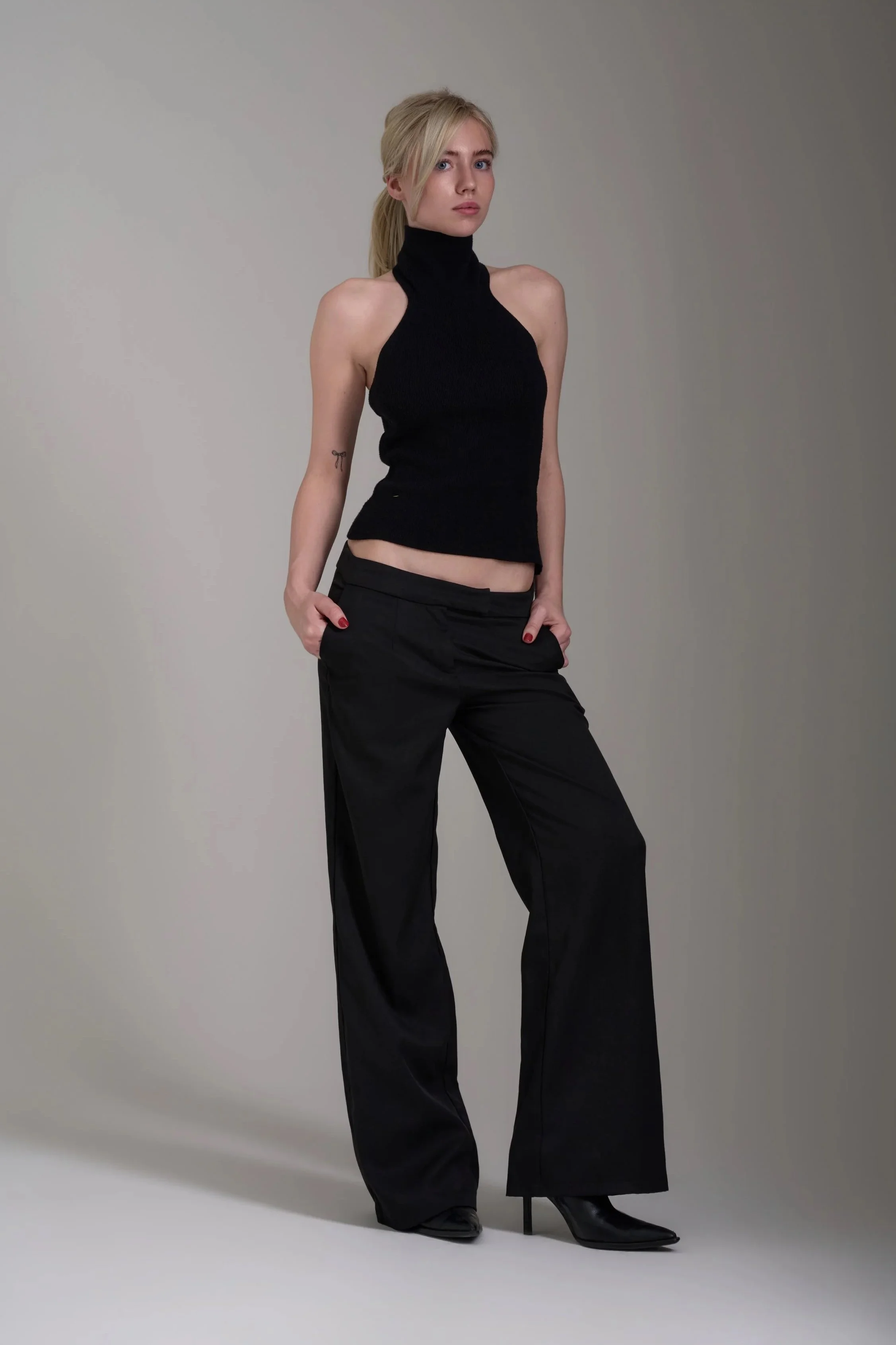 Beginner model is posing in black suit for her fresh model portfolio in London