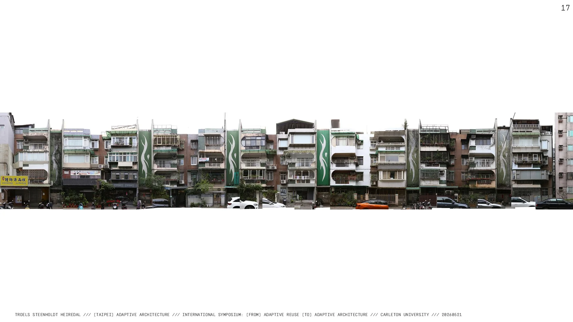 A photo composition stitched together, showing a four-floor building with green stair towers. The exterior of each unit has been changed by the owners, adding cages, glazed build-outs, or altering the balcony, so now no two are the same.