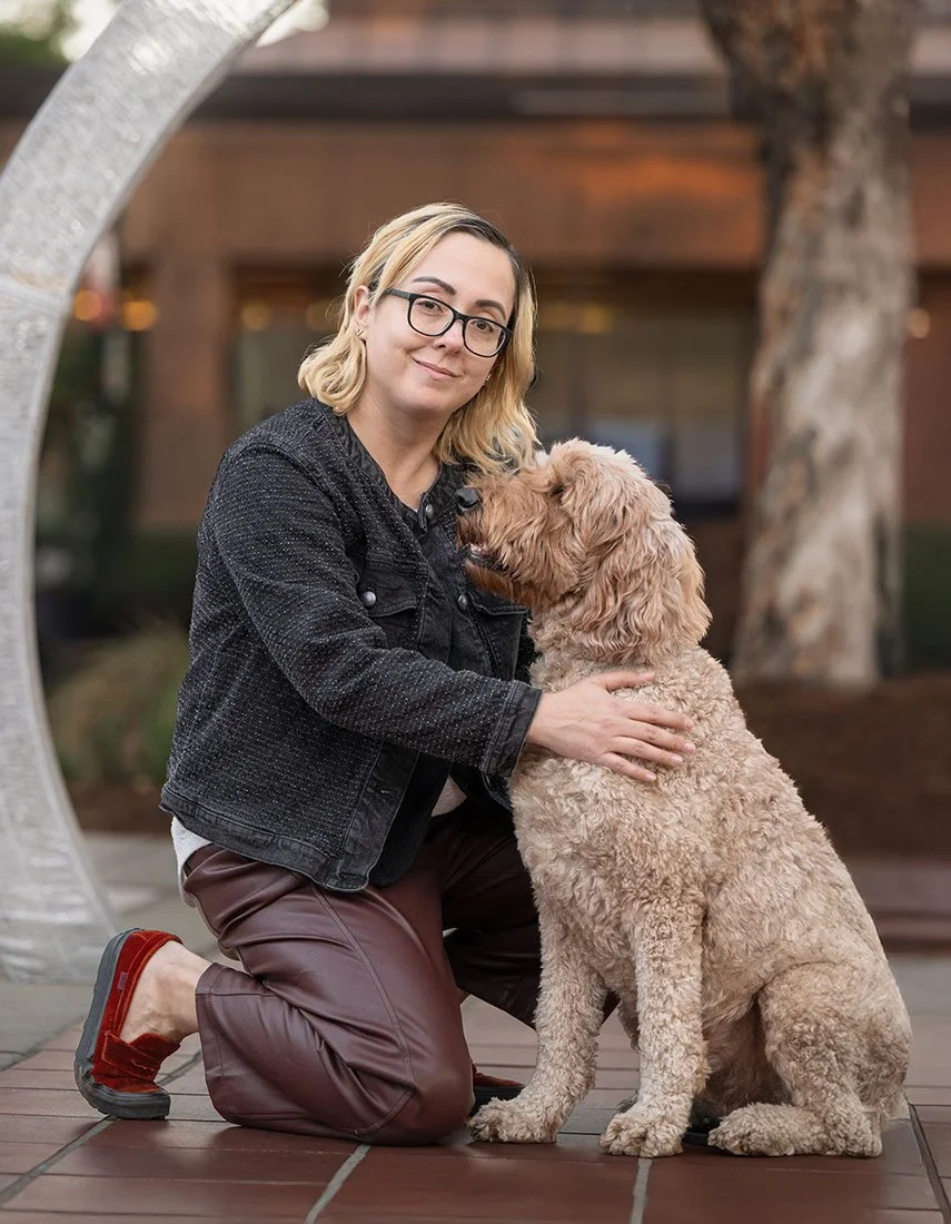 Stephanie Munson, founder of Moxie Creative Solutions, with her dog during a brand photoshoot in the Inland Empire