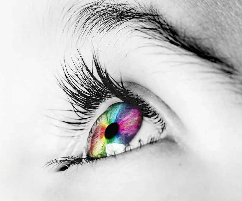 Close-up of an eye with a colorful iris symbolizing creativity and brand vision