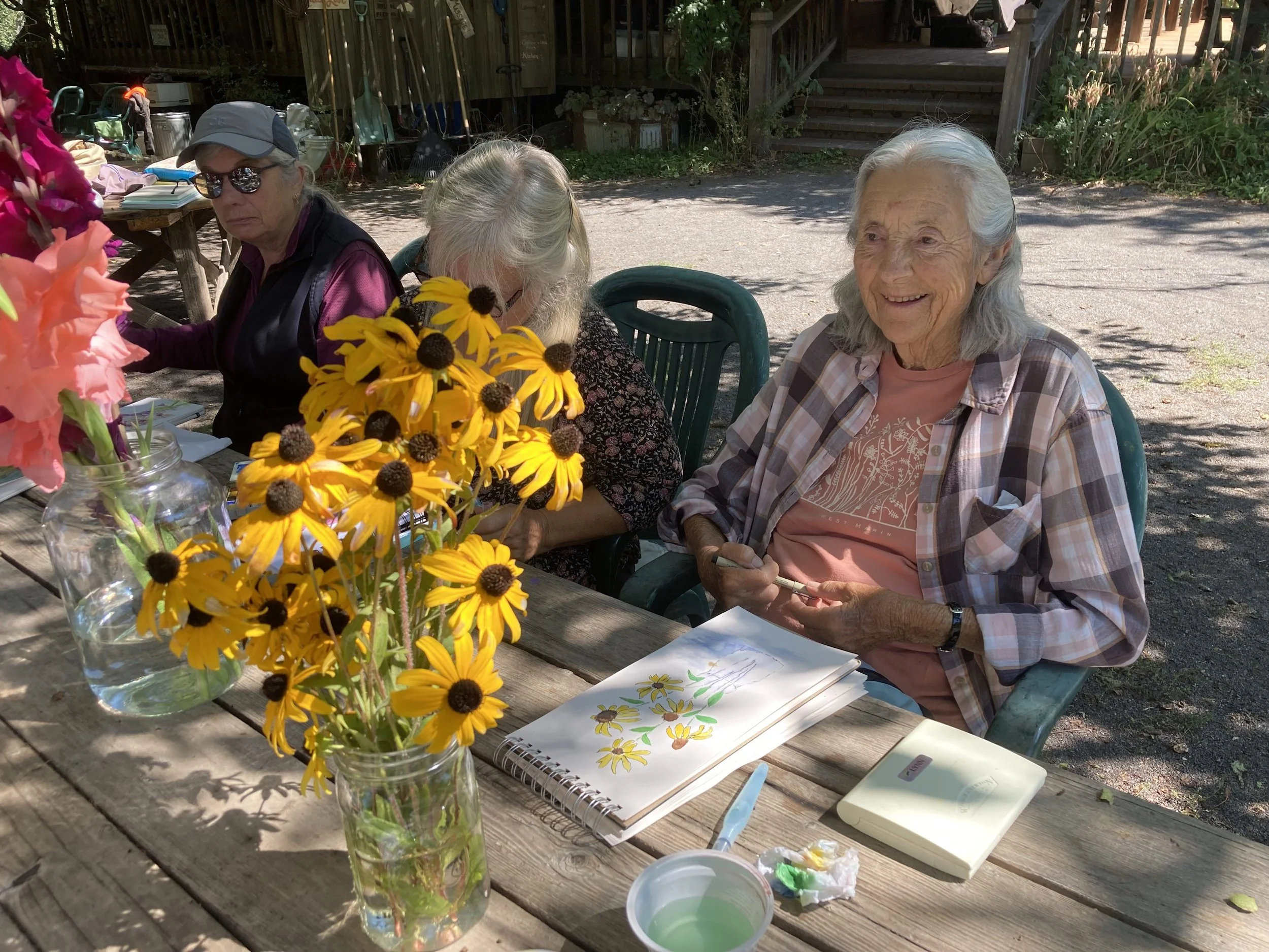 Artist with painting 2025.jpg