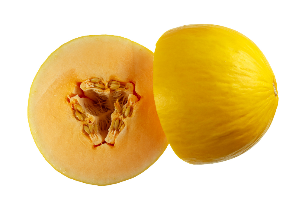 A whole yellow melon and a half yellow melon with seeds visible inside, placed on a white background.