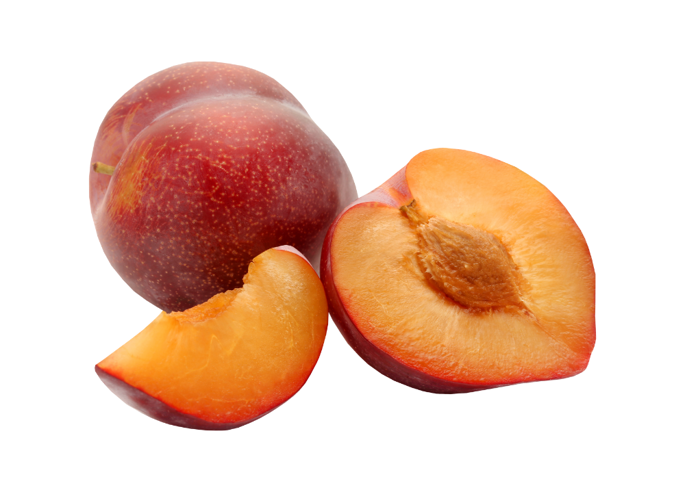 Fresh peaches, one whole and one cut in half showing the seed, with a small peach slice in front.