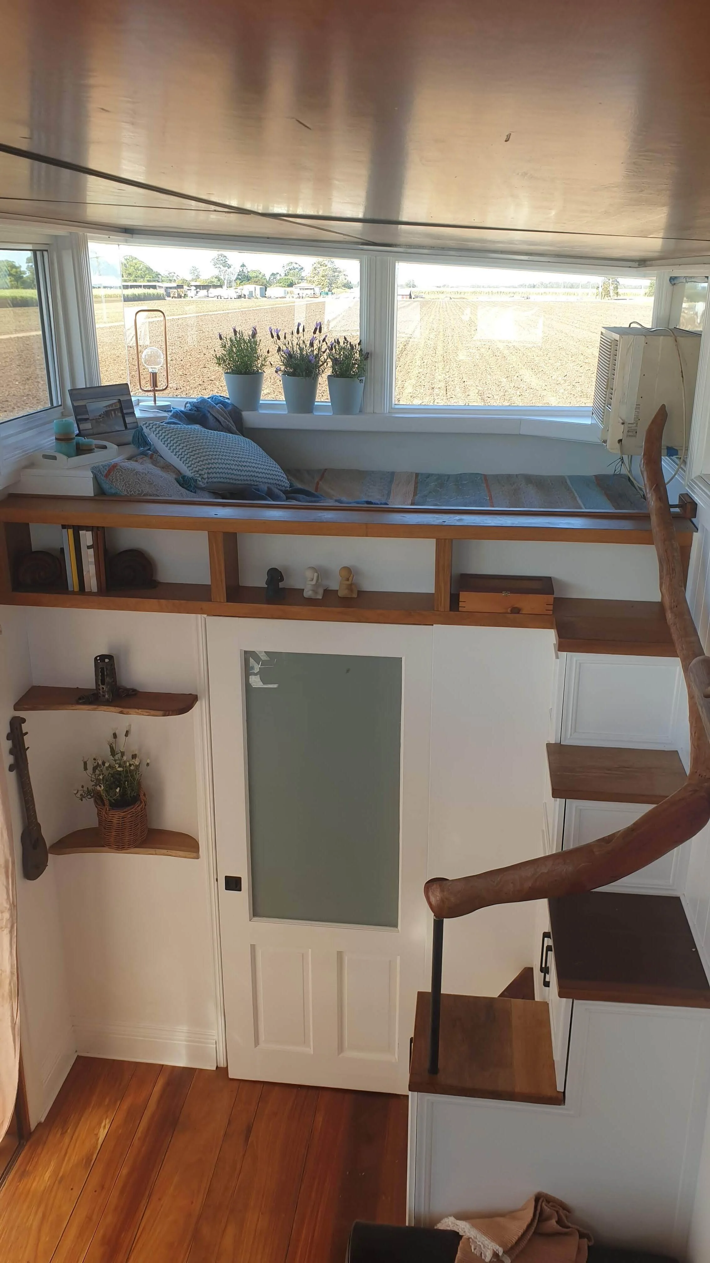 Curved driftwood hand rails continuing the timber theme throughout