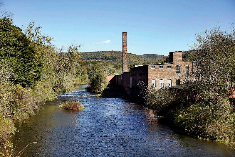 A developer has resubmitted plans to redevelop the former Eagle Mill in Lee, removing much of the commercial component of the project and expanding the number of residential units.EAGLE FILE PHOTO