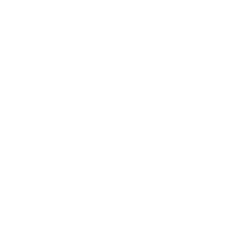 Silhouette of a person pointing at a board or screen, within a circle on a black background.