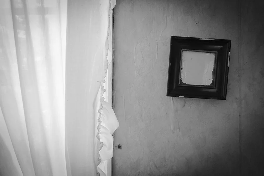 S Lawhorne Photography | crumbling-photo-in-frame-on-wall.jpg