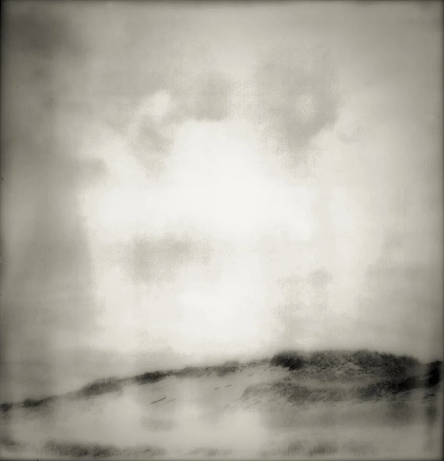 a distressed polaroid image of sand dunes at great island trail in cape cod