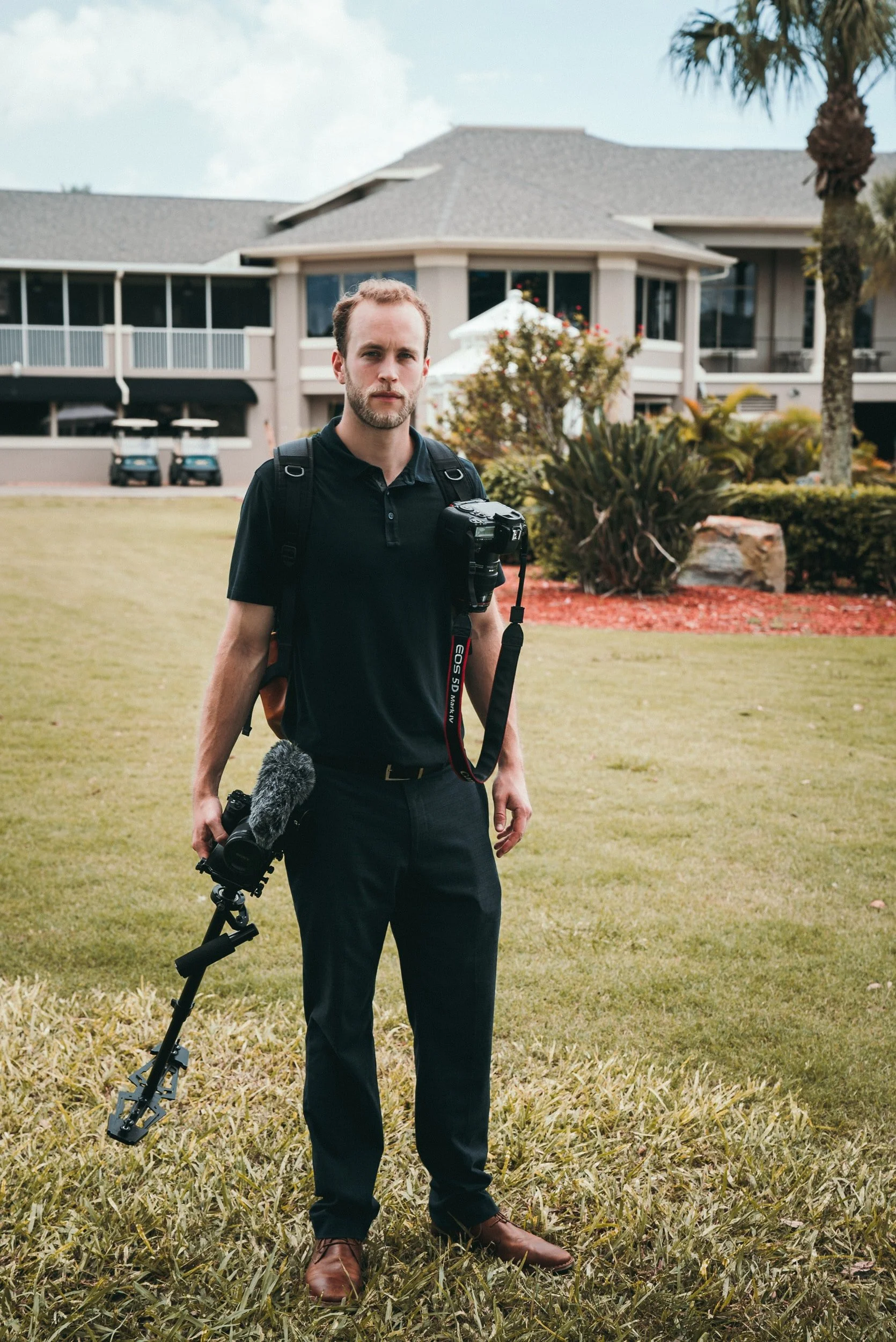 A Toronto wedding video posing for the camera while working.