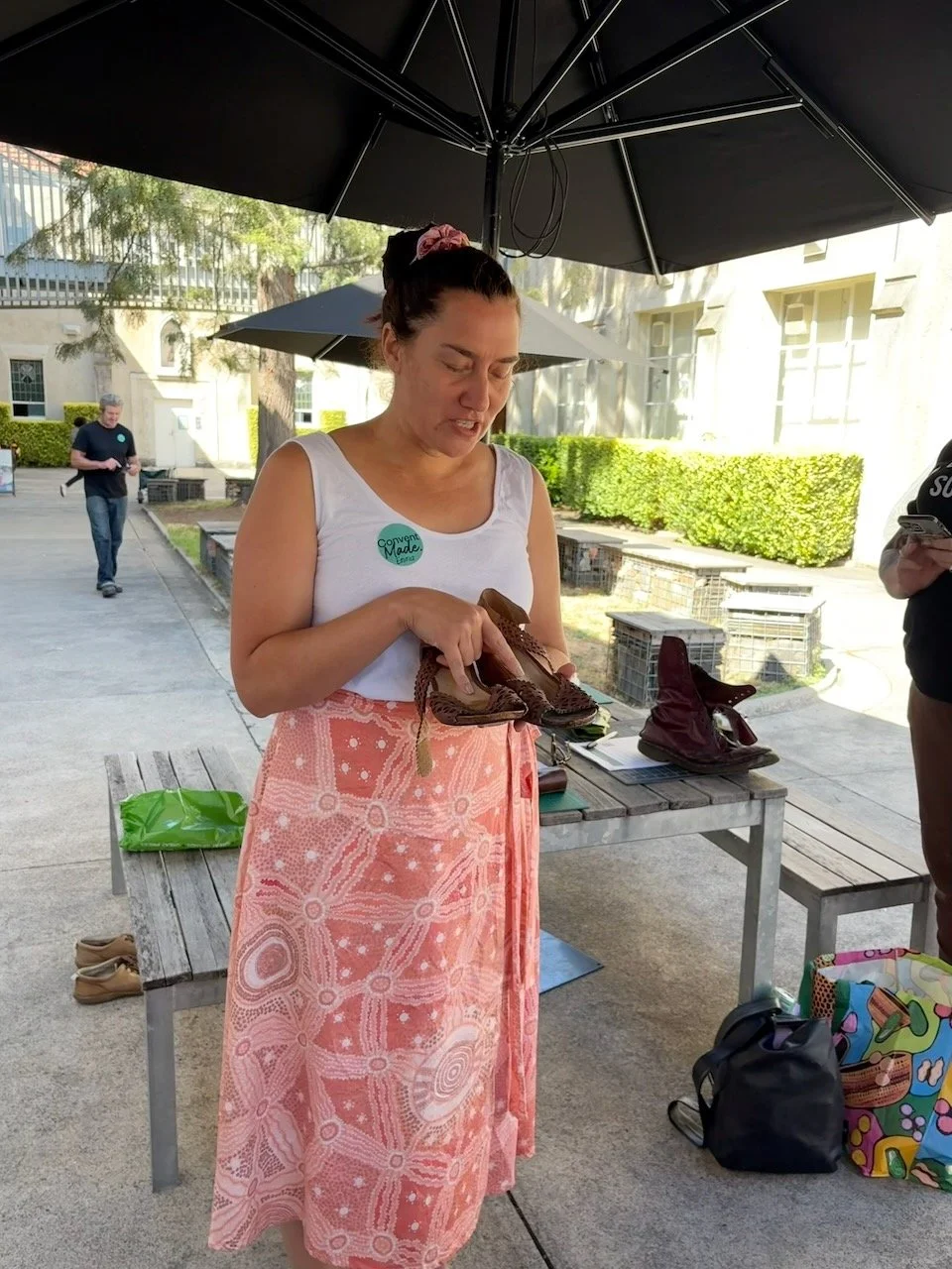 Emma telling the story of her shoes to fellow workshop participants
