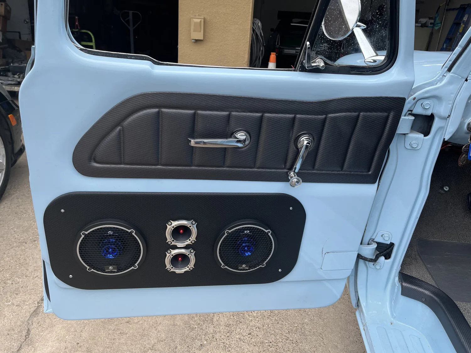 Vehicle-specific door panel components installed in a classic truck