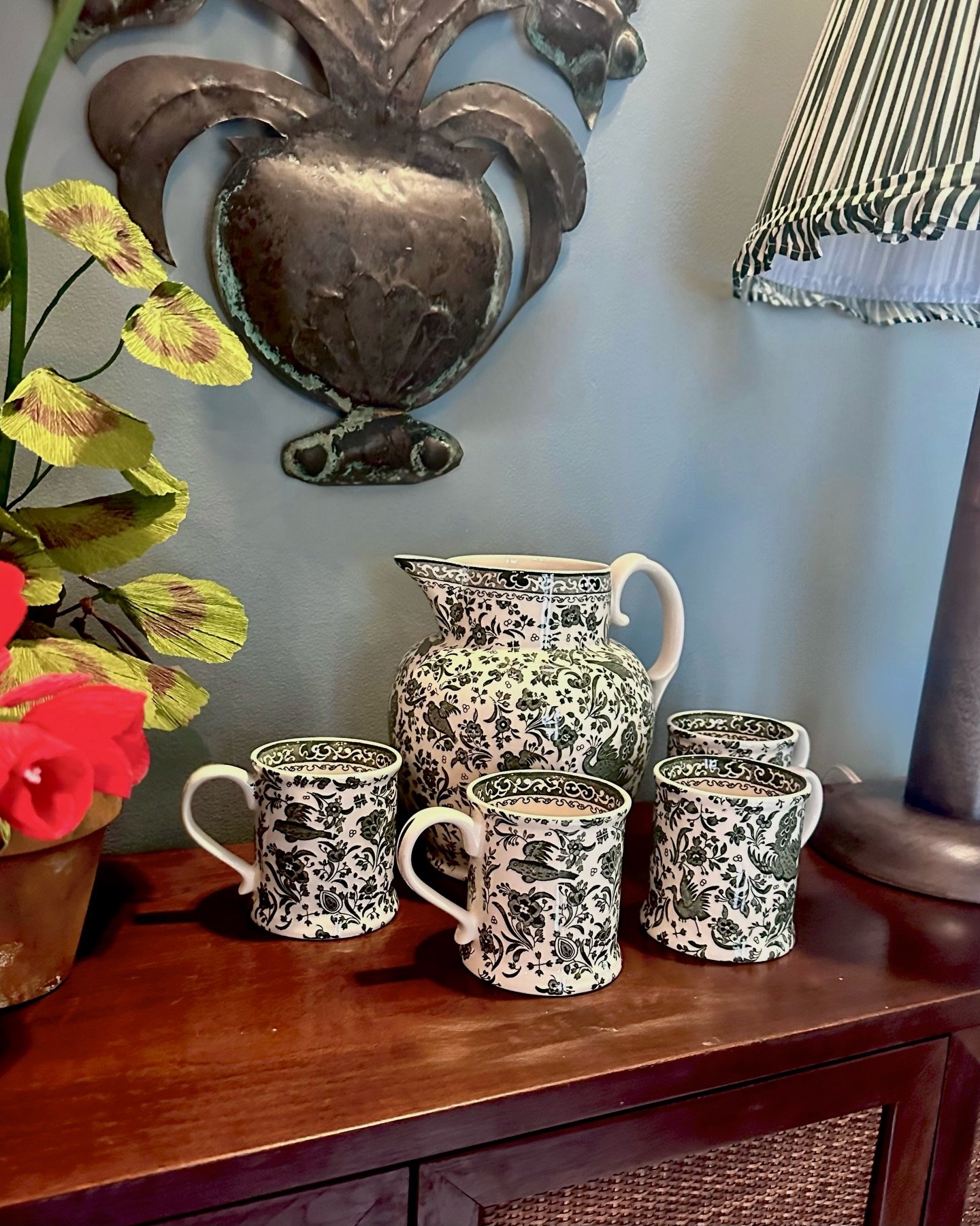The charm of this gorgeous green peacock pattern caught my eye at a recent antique store visit. Pottery that adds a feeling of the English countryside to any table setting and you can even use the pitcher for a beautiful floral arrangement. 

We have