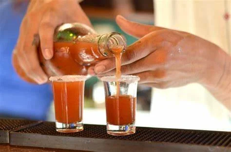 Two shot glasses filled with Chili Guaro
