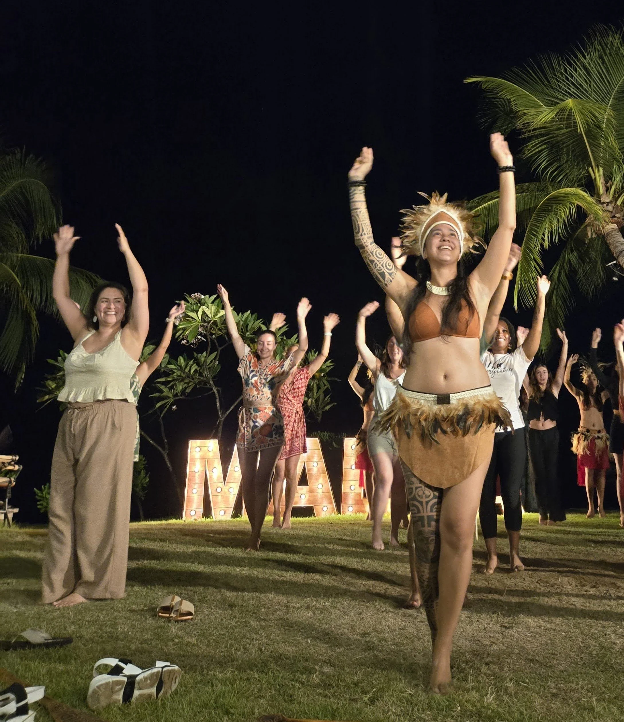 Traditional Polynesian dinner show with fire dancing, part of the Ladies Touch LGBTQ women's French Polynesia trip