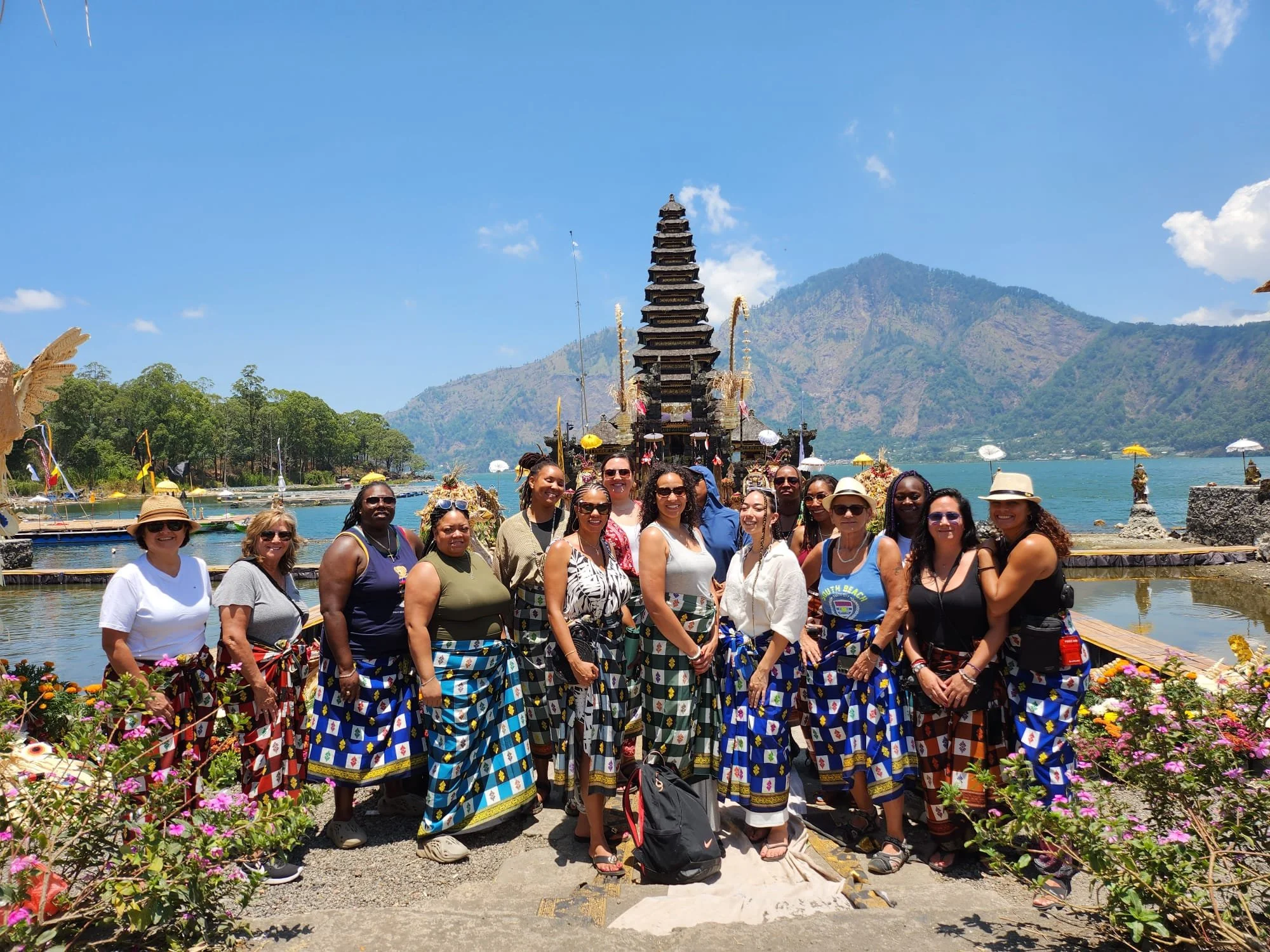 Lesbian travelers in traditional sarongs at a Balinese water temple with Ladies Touch