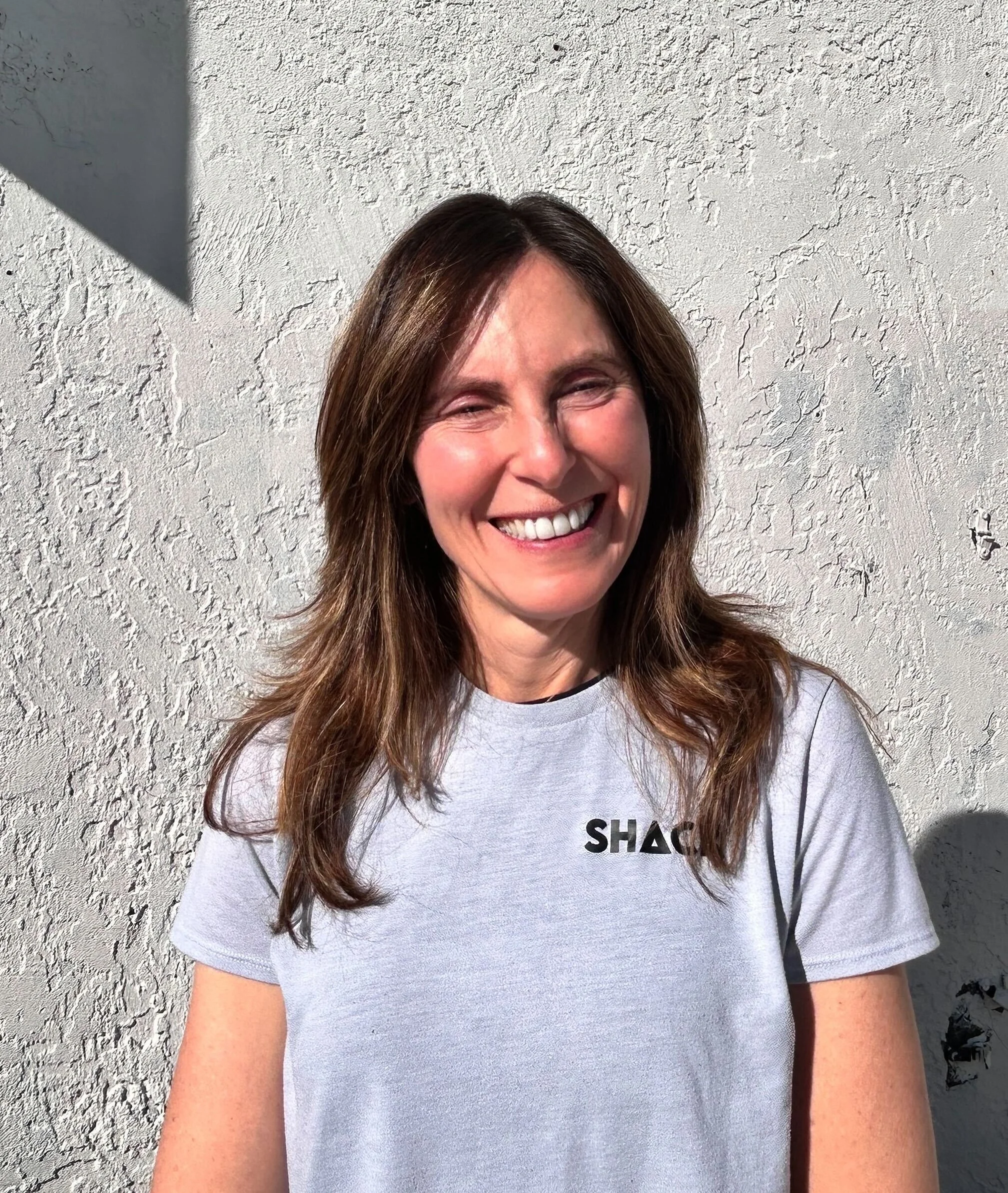 Silhouette of a hand making a peace sign.