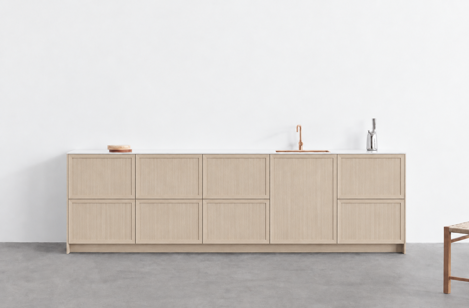 Flat-front beige cabinets with rose gold fixtures.png