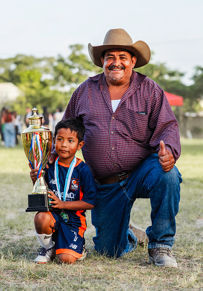 Serve Hope Soccer Player, celebrating with his dad after winning the championship