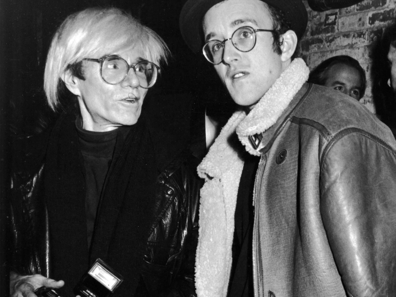 Andy Warhol and Keith Haring at Claes Oldenburg Guggenheim Party, 1986 © Ron Galella