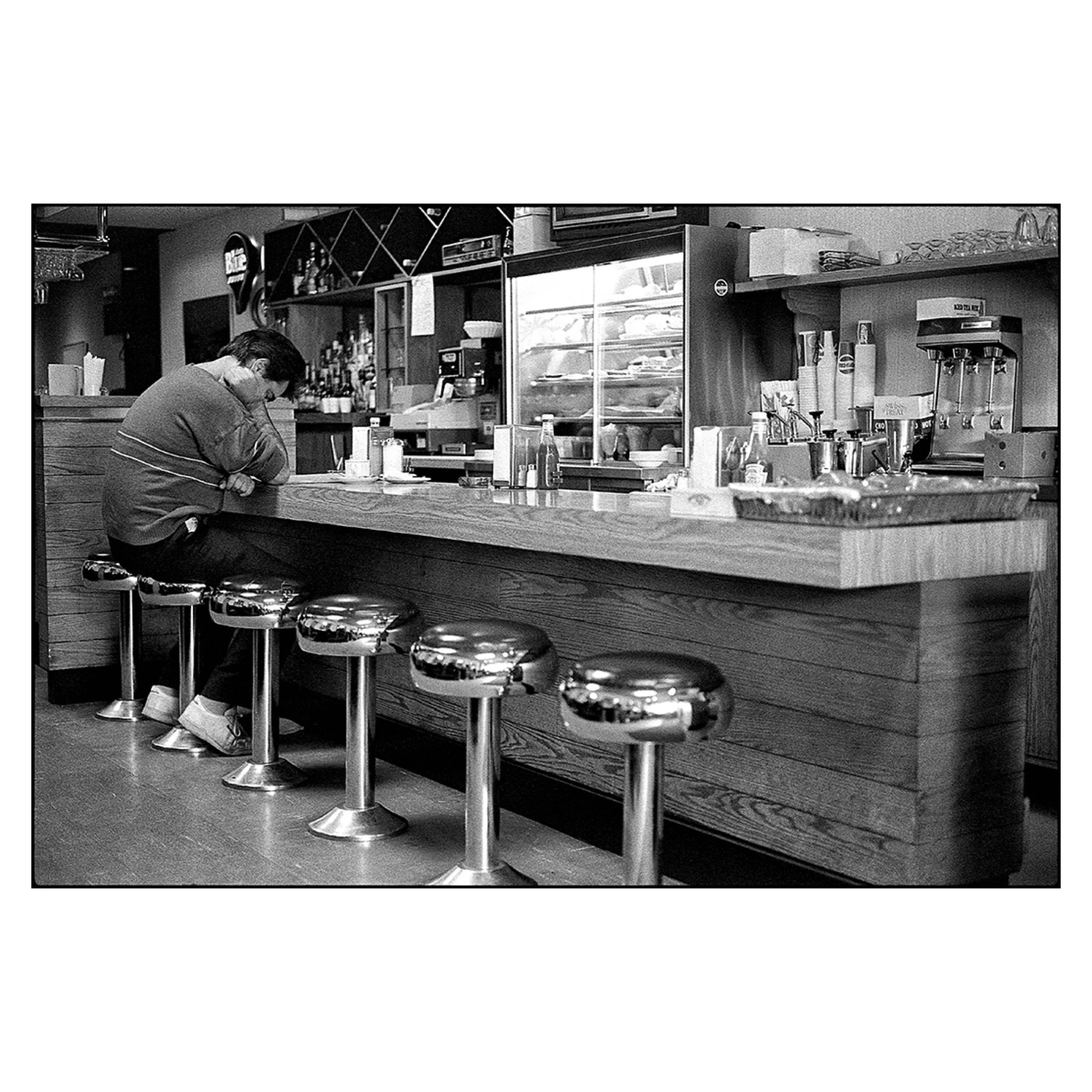 Alone at the diner counter, Toronto, 1989 © Dave Green