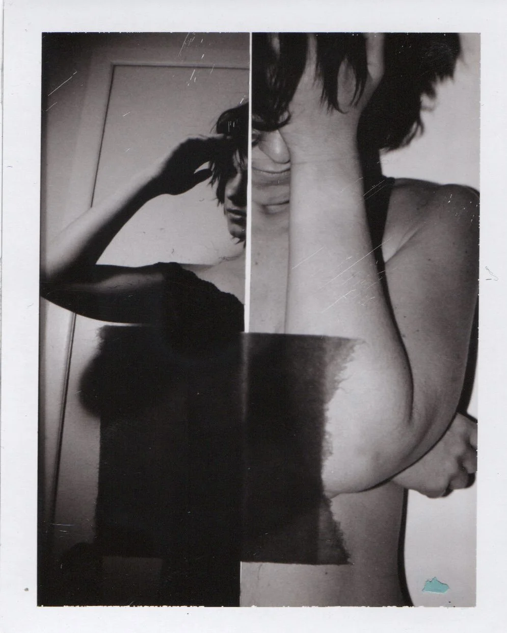 A black-and-white collage photo of a woman with short dark hair, capturing her in two poses. She is holding her head with her left hand, partially covering her face, and she appears to be looking down or away. The image has visible scratches and a sm