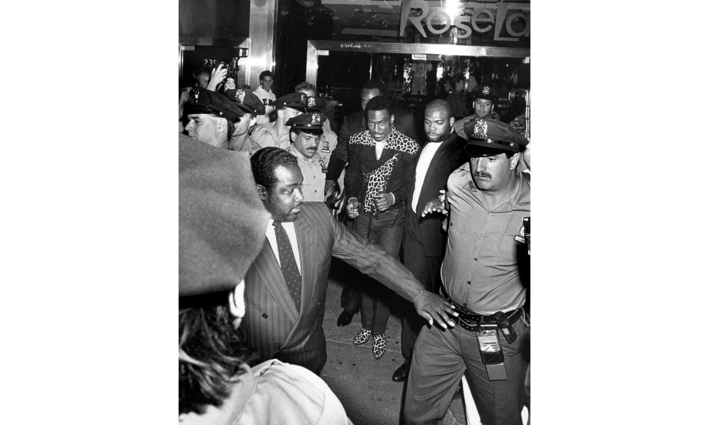 Eddie Murphy and Bodyguards at “Untouchables” Premiere, Loews Astor Plaza, NYC 1987 © Ron Galella