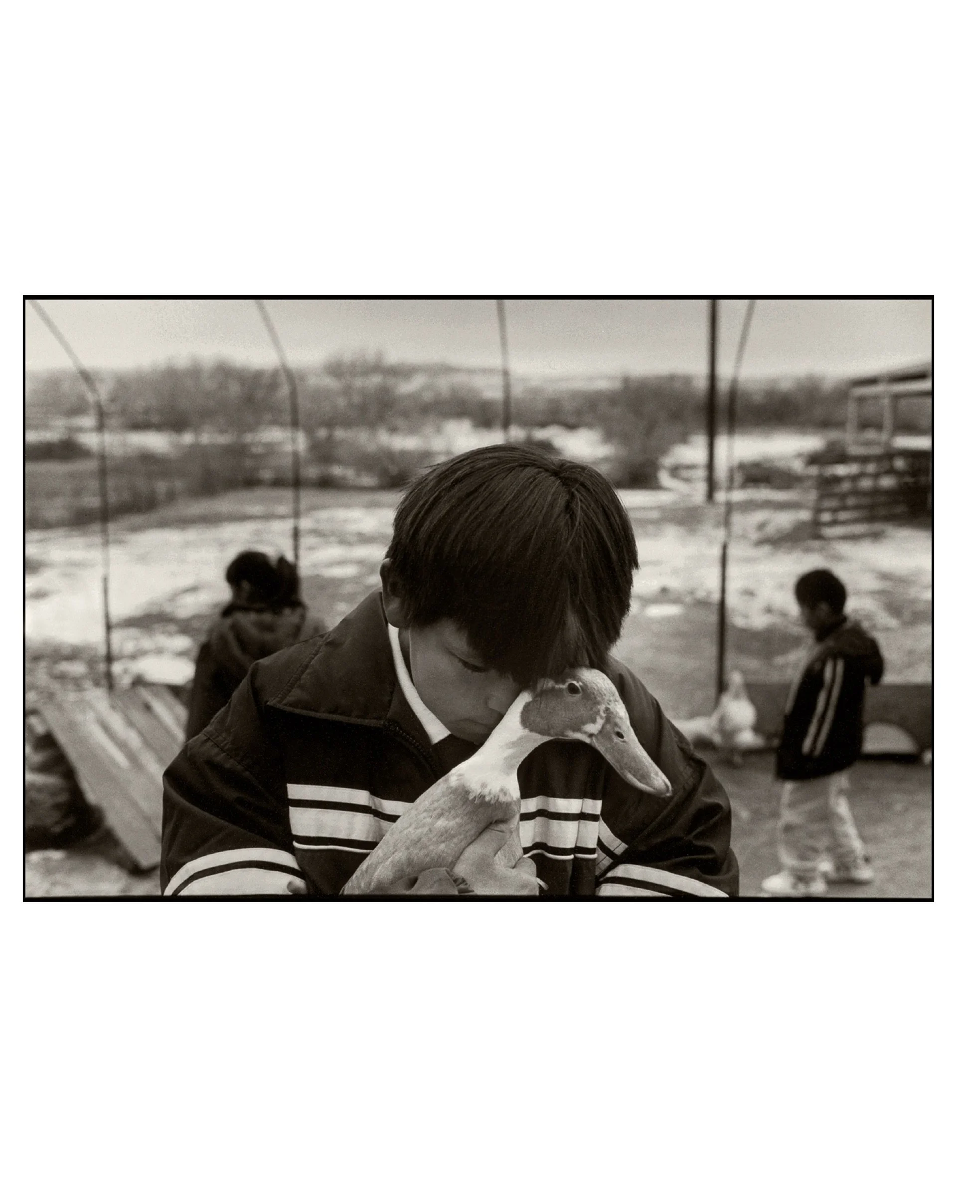 Boy and his Duck, Farmington, NM, 2001 © Saul Bromberger & Sandra Hoover