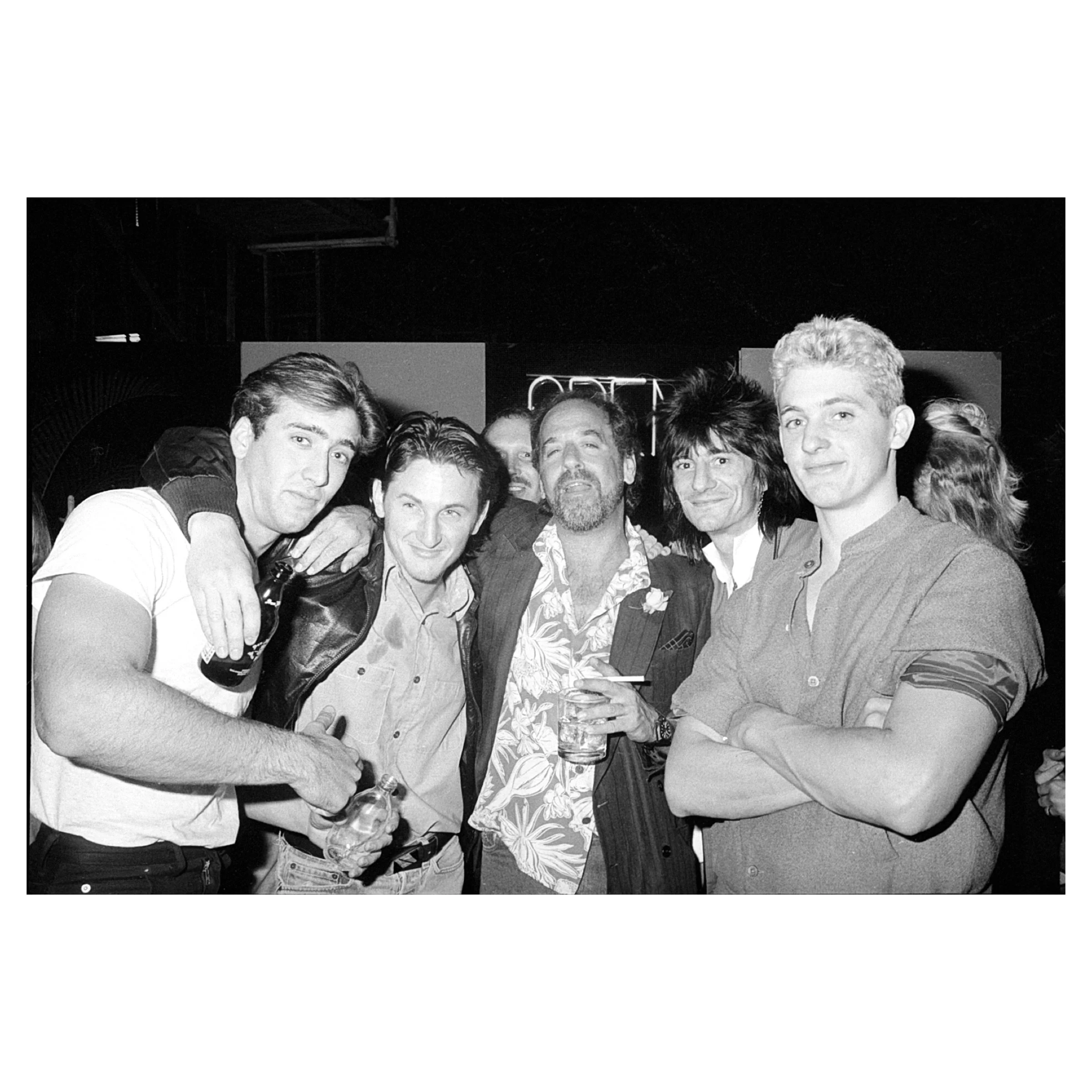 Nicolas Cage, Sean Penn, Art Linson, Ronnie Wood, & Chris Penn at the Premiere Party for The Wild Life, Los Angeles, 1984 © Jim Frank