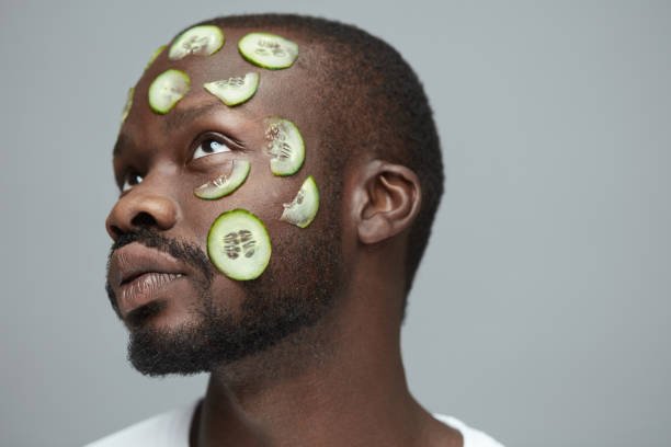 man with cucumber on face.jpg