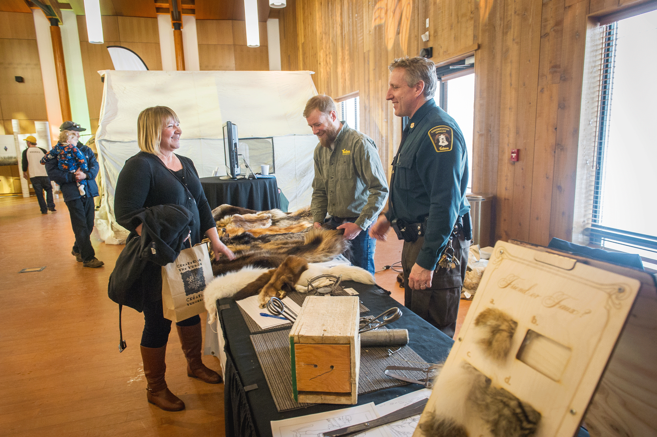 Event photograph by Cathie Archbould showing an image of Environment Yukon's educational display created for Unfurled in 2018
