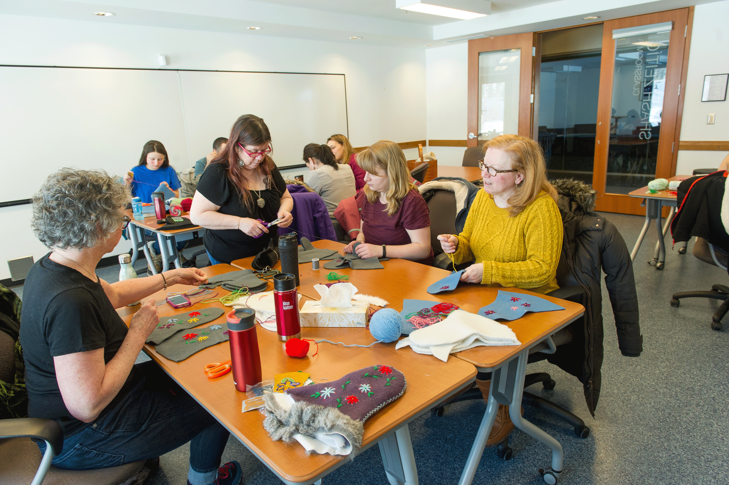 Event photograph by Cathie Archbould showing an image of a fur mitt crafting workshop created for Unfurled in 2018