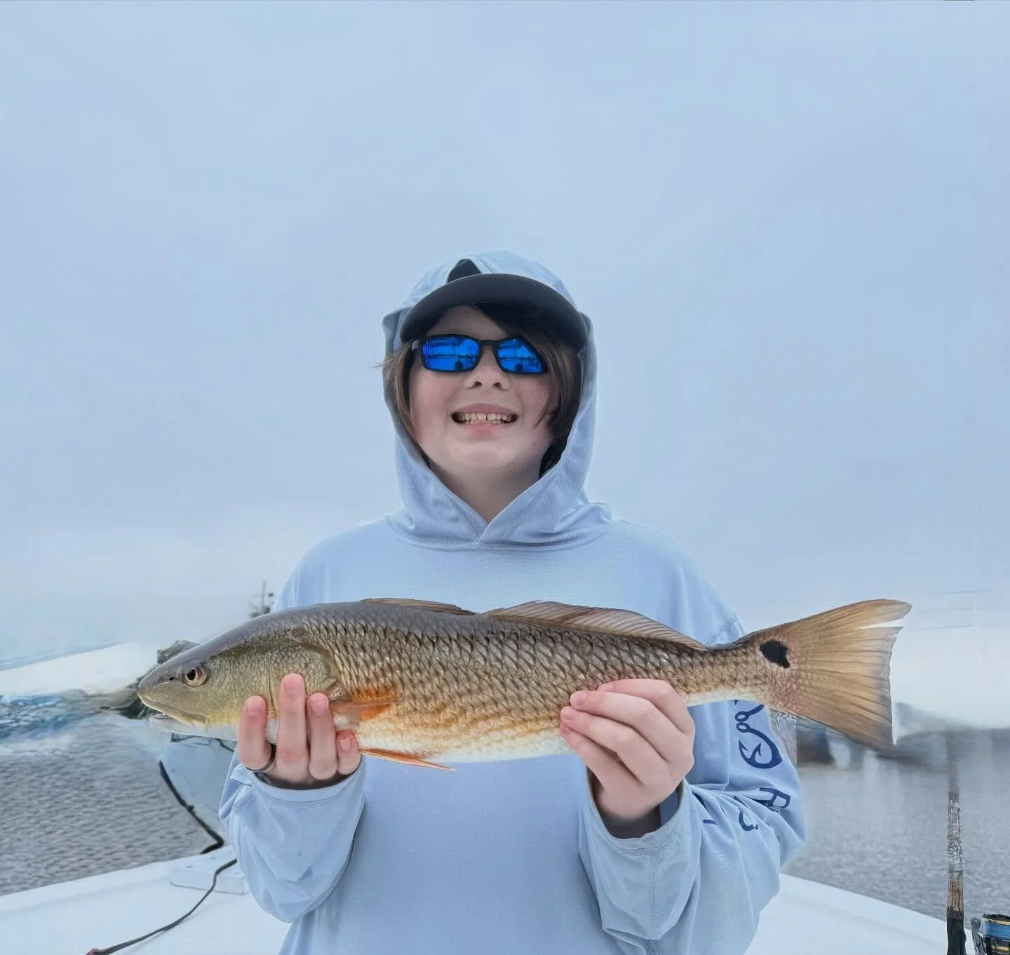 All smiles for Hunter and Nick. Kept the rods bent on a foggy, windy day in March.