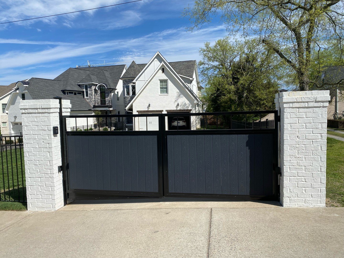 Custom steel gate with Trex infill and automation along with a classic black aluminum fence &gt; Call us to get yours today! 615-410-6120 🤠