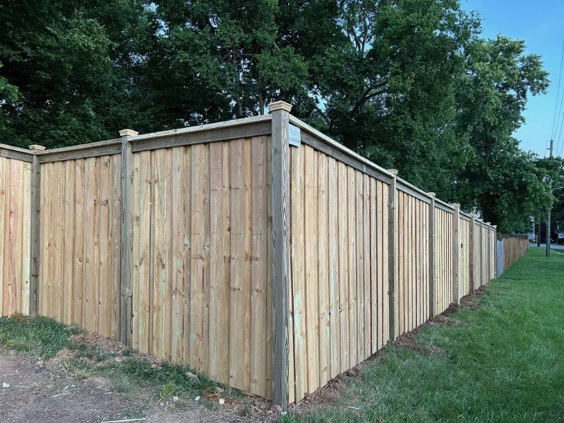 Classic and Timeless Wood Fence by Kowboy Fence: Enhancing Your Property with Natural Beauty and Privacy.