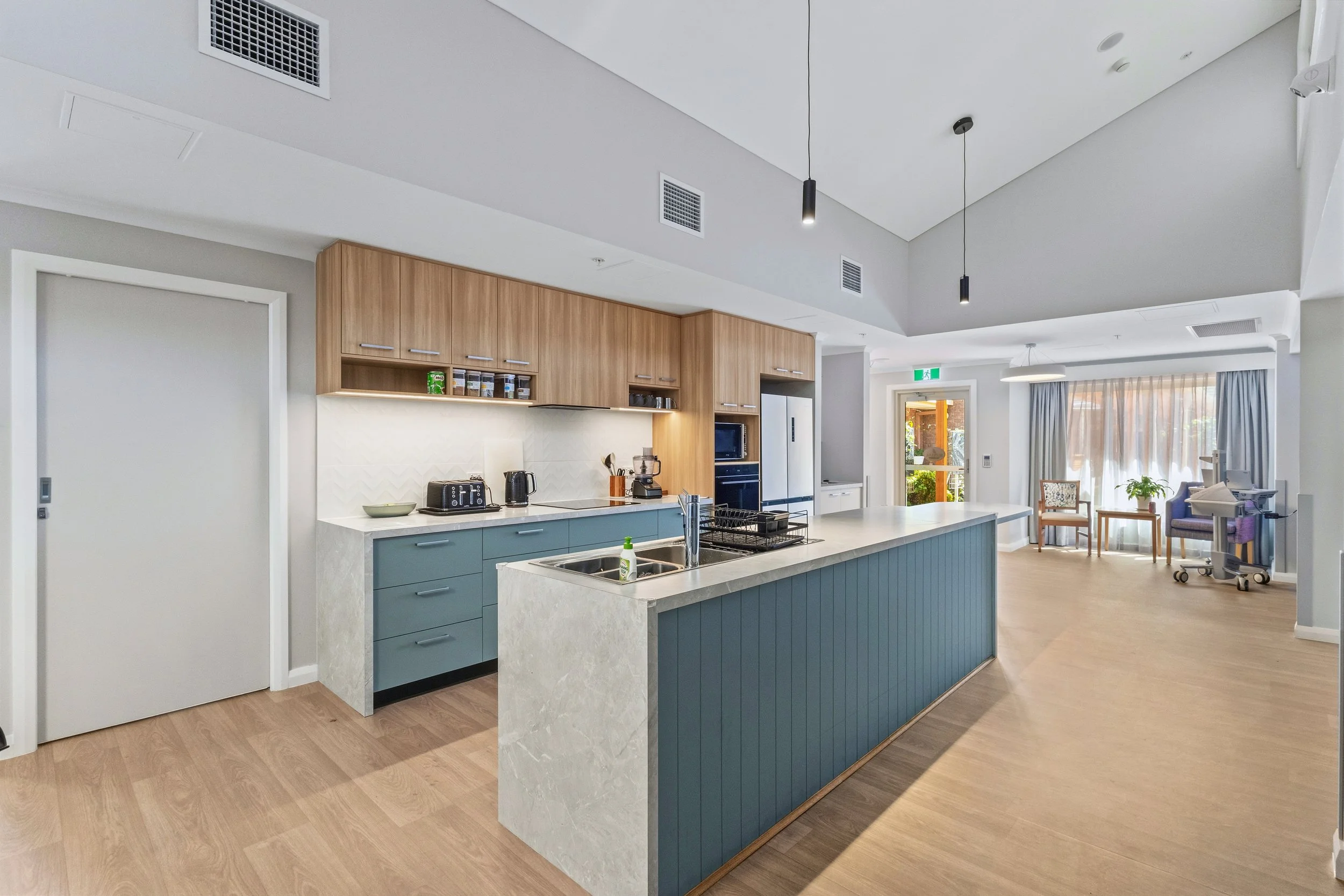 A domestic kitchen at the center of each house