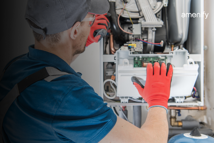 Ahandyman fixing a water heater