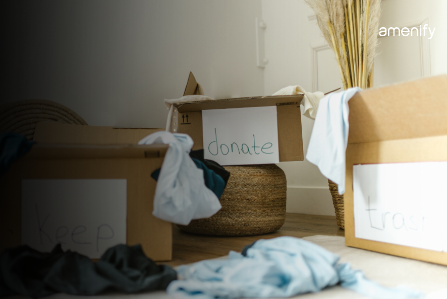 Cardboard boxes labeled keep, donate, and trash for sorting household items during a decluttering session.
