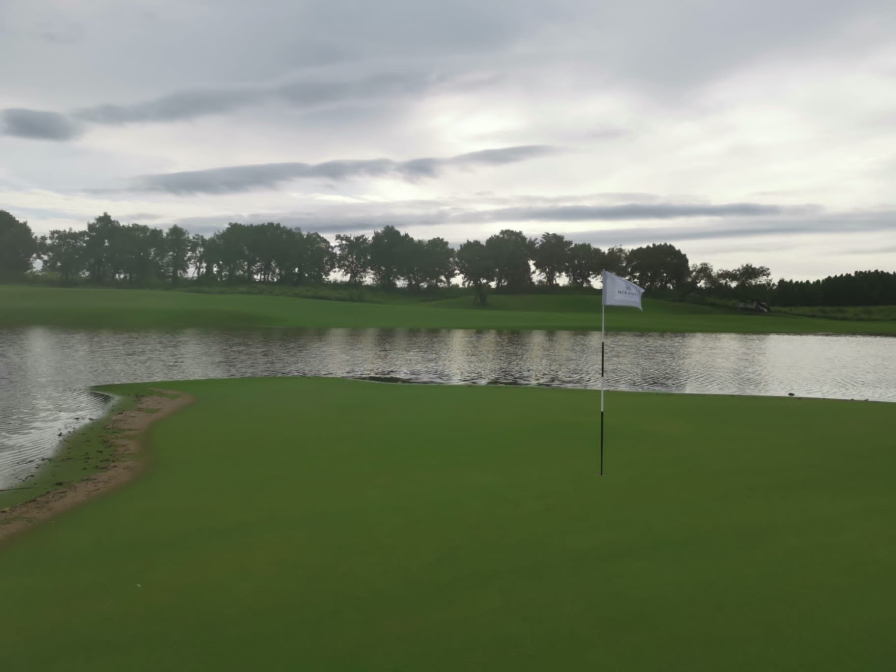  The 3rd green partially submerged due to the rising lake levels from the heavy, persistent rain. 