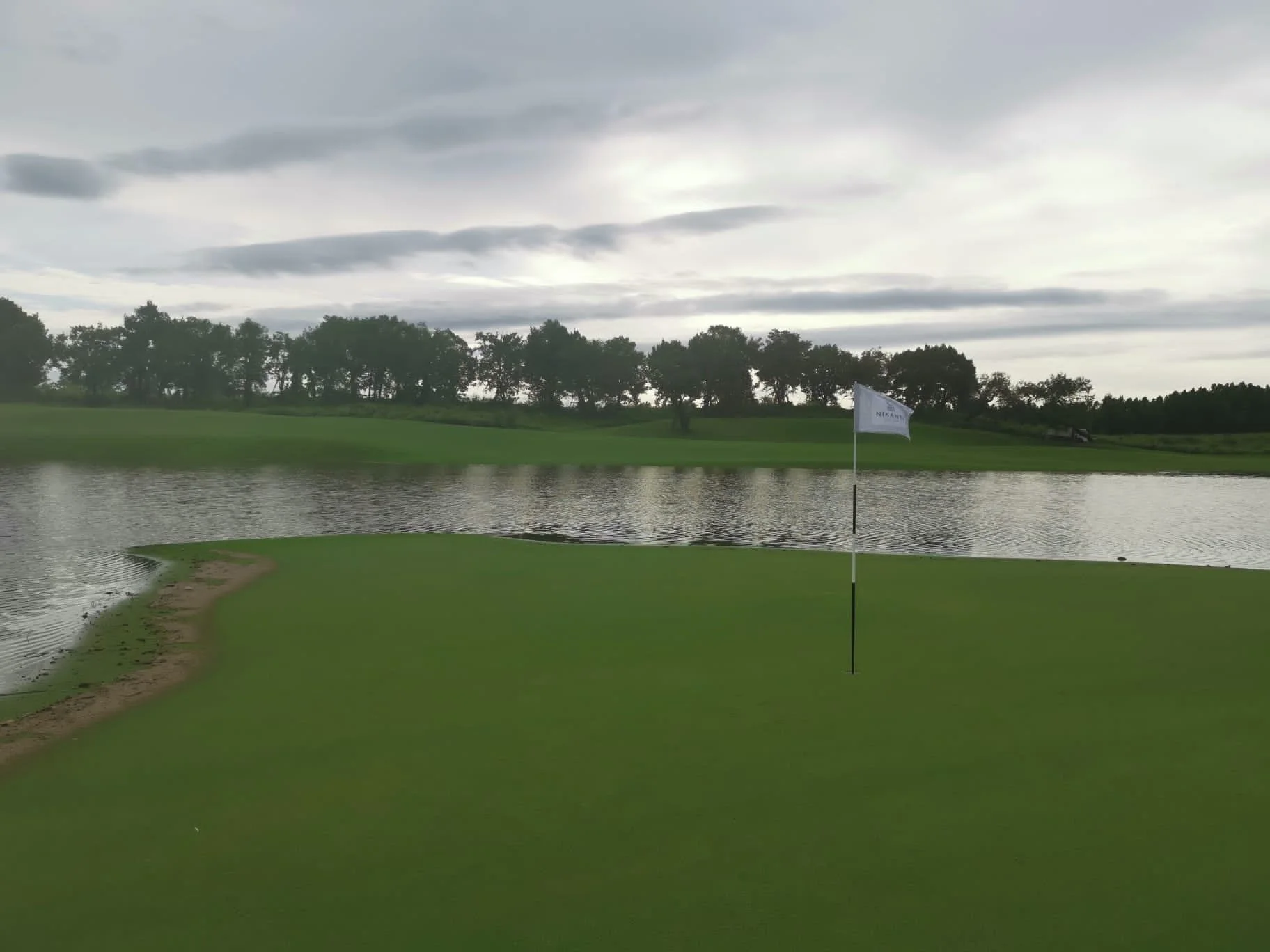  The 3rd green partially submerged due to the rising lake levels from the heavy, persistent rain. 