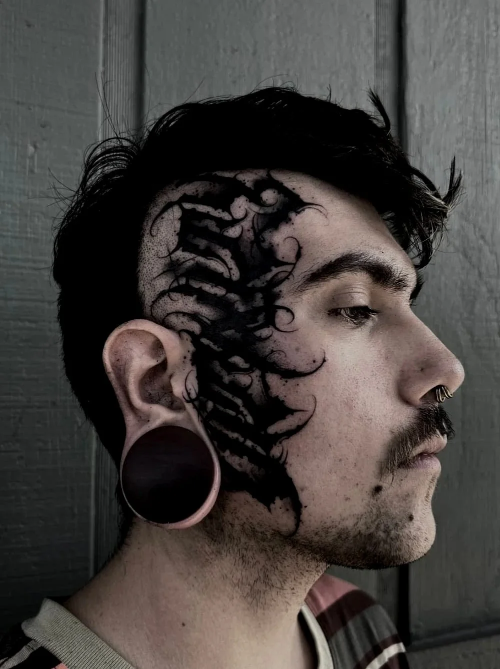 blackwork-script-face-tattoo-austin.jpg